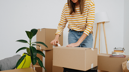 Woman packing to move to a new house